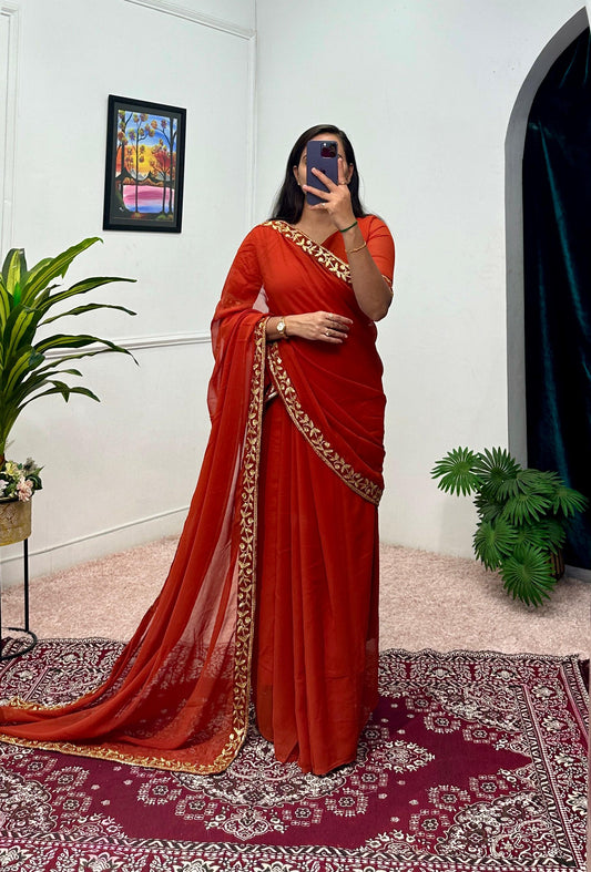 Captivating Embroidery Work Orange Color Saree Gown