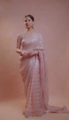 Charming Chiffon Zari Line Work Peach Color Saree Charming Chiffon Zari Line Work Peach Color Saree