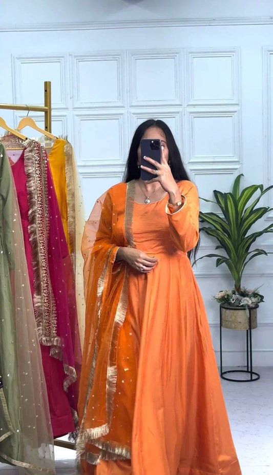 Preferable Orange Color Plain Gown With Work Net Dupatta