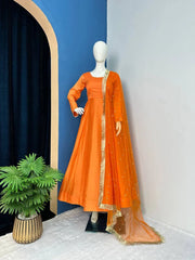 Preferable Orange Color Plain Gown With Work Net Dupatta