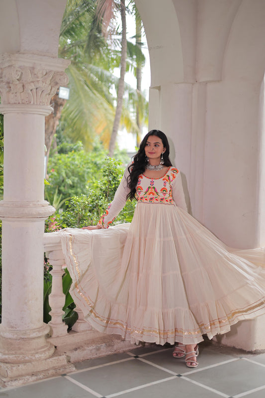 Ravishing White Cotton Embroidered Gown For Navratri