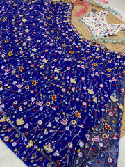 Precious Net Embellished Blue Color Lehenga Choli