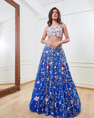 Precious Net Embellished Blue Color Lehenga Choli