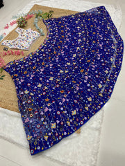 Precious Net Embellished Blue Color Lehenga Choli
