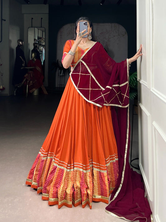 Lovely Orange Rayon Bandhej Print Lehenga Choli