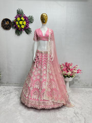 Presenting Embroidered Work With Peral Moti Work Peach Color Lehenga Choli