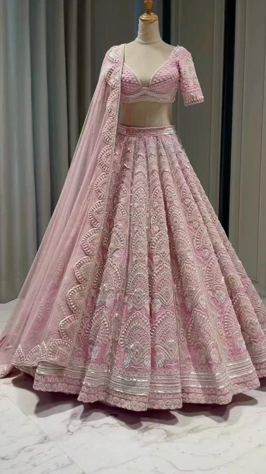 Presenting Embroidered Work With Peral Moti Work Peach Color Lehenga Choli