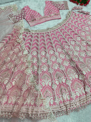 Presenting Embroidered Work With Peral Moti Work Peach Color Lehenga Choli