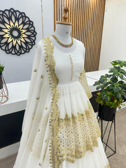 Mesmerizing Embroidery Sequence Work White Color Top With Lehenga