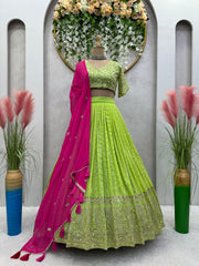 Traditional Wear Parrot Green Lehenga Choli With Pink Dupatta