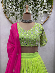 Traditional Wear Parrot Green Lehenga Choli With Pink Dupatta