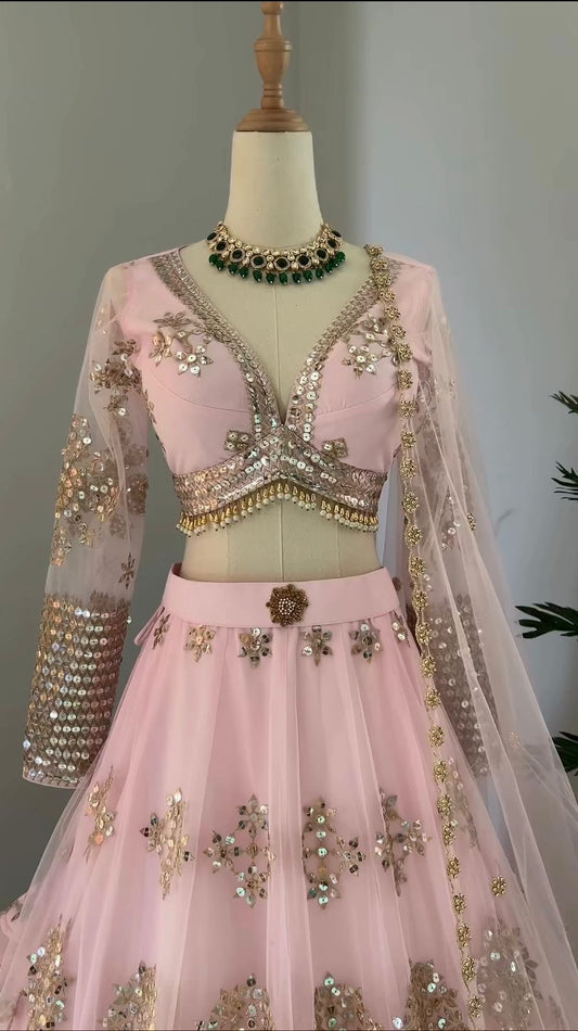 Ravishing Sequence Work Light Pink Net Lehenga Choli