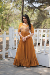 Shining Georgette Multi Thread Mustard Color Long Gown