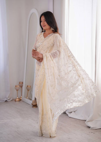 Opulent Peach Silk Saree with Beads Work