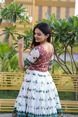 Precious White Color With Green Print Patola Silk Gown