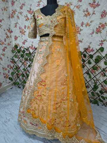 Ravishing Beige and Orange Crape Silk Embroidered Lehenga