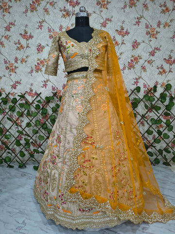 Ravishing Beige and Orange Crape Silk Embroidered Lehenga