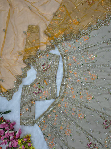 Ravishing Beige and Orange Crape Silk Embroidered Lehenga
